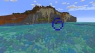 A coral reef feeds into a lush cave system not far from this Minecraft seed's spawn (Image via Mojang)